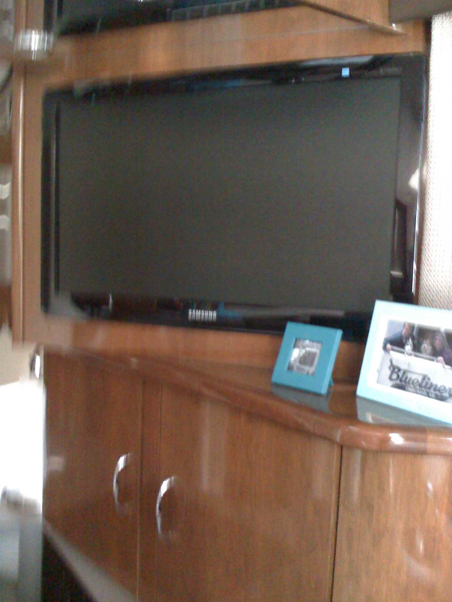 TV and electronics cabinet installation in a salon